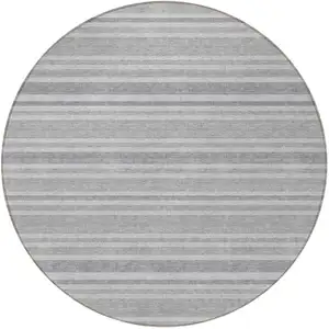 Photo of 8' Round Black Silver and Gray Round Striped Washable Non Skid Indoor Outdoor Area Rug