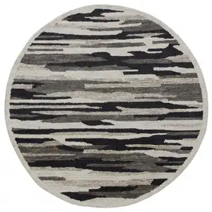 Photo of 4' Round Black and Gray Camouflage Area Rug