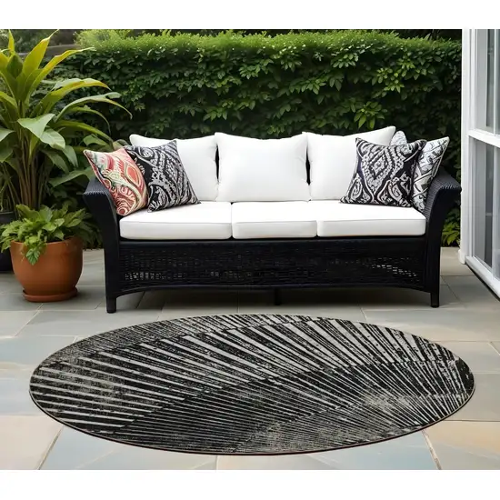 Black and Ivory Round Abstract Washable Non Skid Indoor Outdoor Area Rug Photo 1