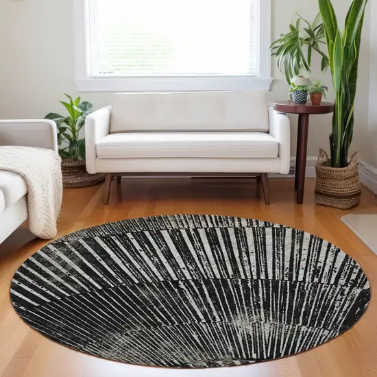 8' Round Black and Ivory Round Abstract Washable Non Skid Indoor Outdoor Area Rug Photo 9