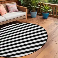 Photo of 8' Round Black and White Round Striped Washable Non Skid Indoor Outdoor Area Rug