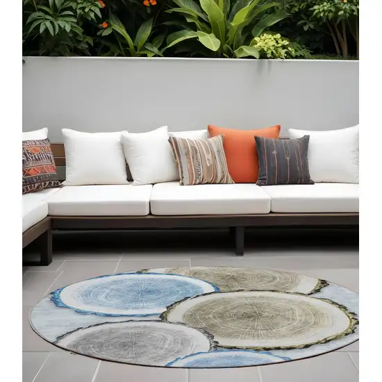 8' Round Blue Gold and Gray Round Faux Bois Washable Non Skid Indoor Outdoor Area Rug Photo 1