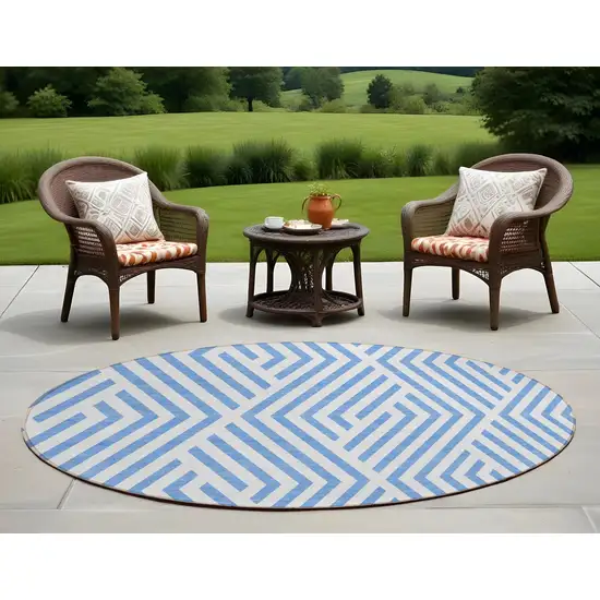 8' Round Blue and Ivory Round Geometric Washable Non Skid Indoor Outdoor Area Rug Photo 1