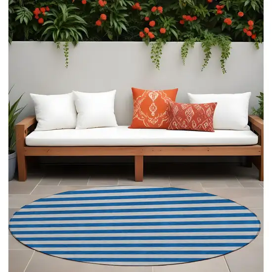 8' Round Blue and Ivory Round Striped Washable Non Skid Indoor Outdoor Area Rug Photo 1