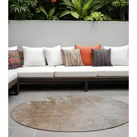 Photo of 8' Round Brown and Off White Round Abstract Washable Non Skid Indoor Outdoor Area Rug