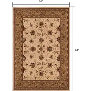 Photo of 5' Round Cream and Tan Ornate Border Area Rug