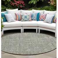 Photo of 8' Round Cream and Tan Round Floral Washable Non Skid Indoor Outdoor Area Rug