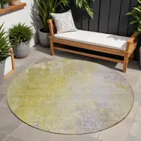 Photo of 8' Round Gold Beige and Purple Round Abstract Washable Non Skid Indoor Outdoor Area Rug