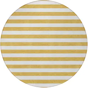 Photo of 8' Round Gold Round Striped Washable Non Skid Indoor Outdoor Area Rug