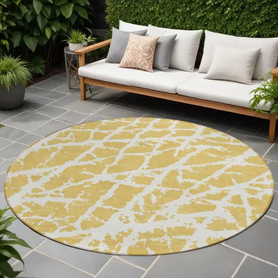 8' Round Gold and White Round Abstract Washable Non Skid Indoor Outdoor Area Rug Photo 1