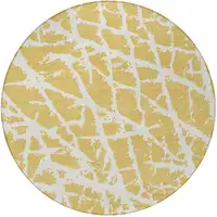 Photo of 8' Round Gold and White Round Abstract Washable Non Skid Indoor Outdoor Area Rug