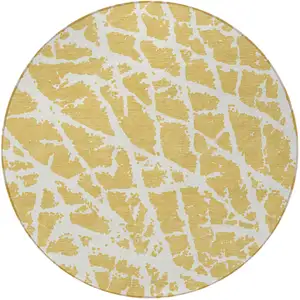 Photo of 8' Round Gold and White Round Abstract Washable Non Skid Indoor Outdoor Area Rug