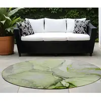 Photo of 8' Round Green Round Abstract Washable Non Skid Indoor Outdoor Area Rug