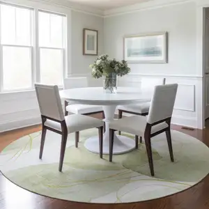 Photo of 8' Round Green and Ivory Round Abstract Washable Non Skid Indoor Outdoor Area Rug