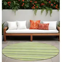 Photo of 8' Round Green and Yellow Round Striped Washable Non Skid Indoor Outdoor Area Rug