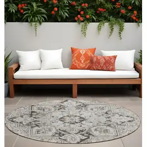 Photo of 8' Round Ivory and Dark Brown Round Oriental Washable Non Skid Indoor Outdoor Area Rug