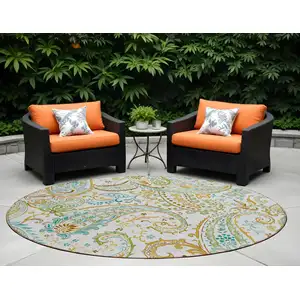 Photo of 8' Round Ivory and Gold Round Paisley Washable Non Skid Indoor Outdoor Area Rug