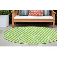 Photo of 8' Round Lime Green and White Round Geometric Washable Non Skid Indoor Outdoor Area Rug