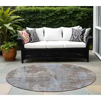 Photo of 8' Round Mocha and Blue Round Abstract Washable Non Skid Indoor Outdoor Area Rug