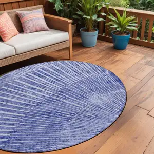 Photo of 8' Round Navy Blue Round Abstract Washable Non Skid Indoor Outdoor Area Rug