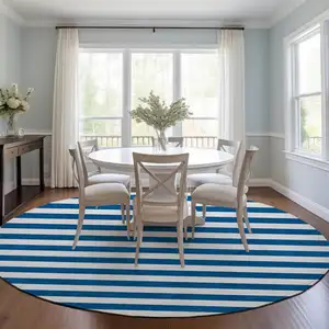 Photo of 8' Round Navy Blue Round Striped Washable Non Skid Indoor Outdoor Area Rug