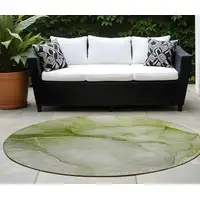 Photo of 8' Round Olive Green Round Abstract Washable Non Skid Indoor Outdoor Area Rug