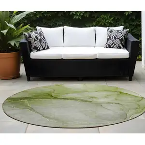 Photo of 8' Round Olive Green Round Abstract Washable Non Skid Indoor Outdoor Area Rug