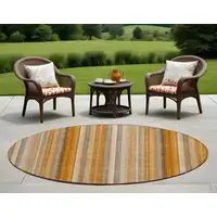 Photo of 8' Round Orange Ivory and Gray Round Striped Washable Non Skid Indoor Outdoor Area Rug