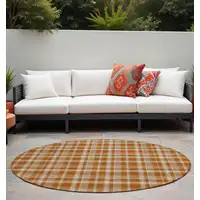 Photo of 8' Round Orange and Ivory Round Plaid Washable Non Skid Indoor Outdoor Area Rug