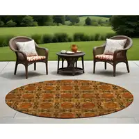 Photo of 8' Round Orange and Rust Round Floral Medallion Washable Non Skid Indoor Outdoor Area Rug