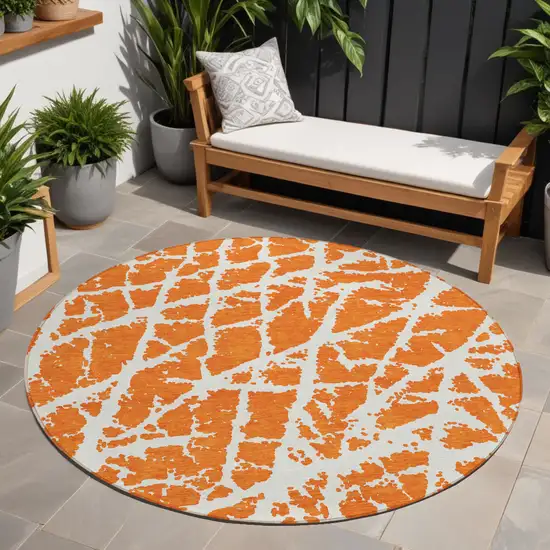 8' Round Orange and White Round Abstract Washable Non Skid Indoor Outdoor Area Rug Photo 1