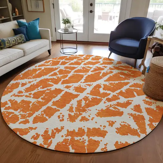 8' Round Orange and White Round Abstract Washable Non Skid Indoor Outdoor Area Rug Photo 9