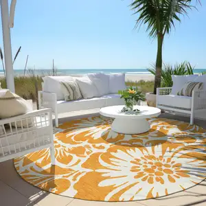 Photo of 8' Round Orange and White Round Floral Washable Non Skid Indoor Outdoor Area Rug