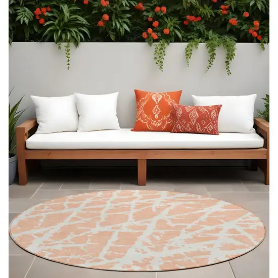 8' Round Peach and Ivory Round Abstract Washable Non Skid Indoor Outdoor Area Rug Photo 1