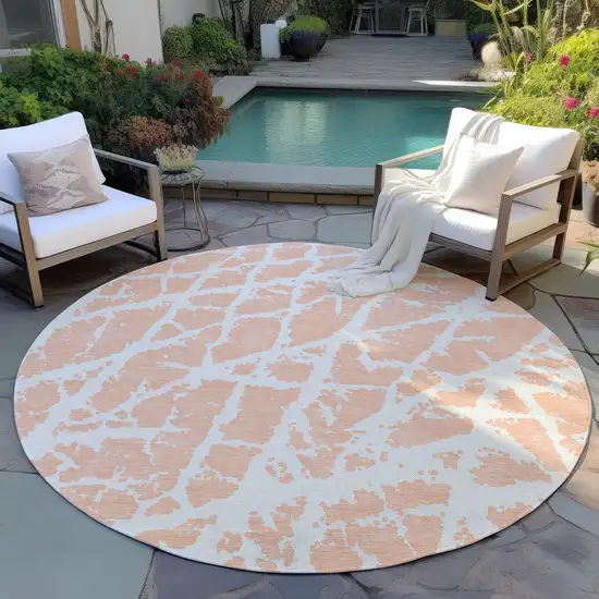 8' Round Peach and Ivory Round Abstract Washable Non Skid Indoor Outdoor Area Rug Photo 8