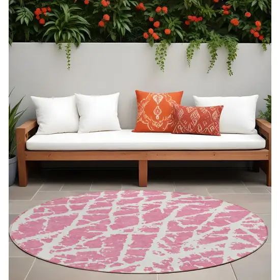 Pink and Ivory Round Abstract Washable Non Skid Indoor Outdoor Area Rug Photo 1