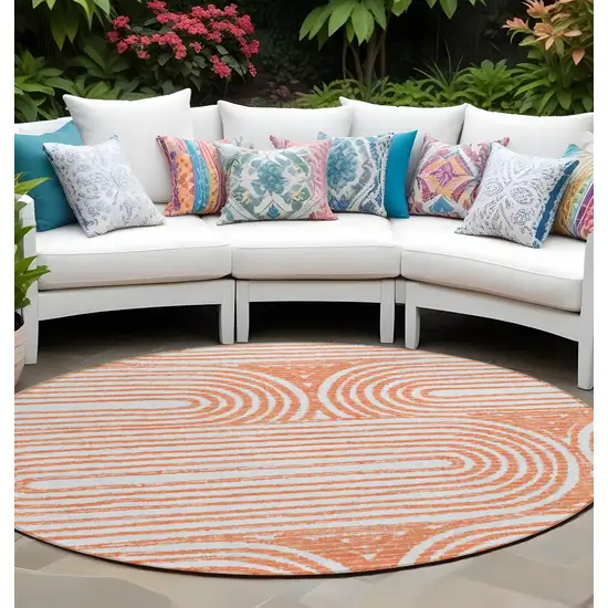 Orange and Ivory Round Abstract Washable Non Skid Indoor Outdoor Area Rug Photo 1