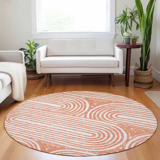 Orange and Ivory Round Abstract Washable Non Skid Indoor Outdoor Area Rug Photo 8