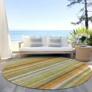 Photo of 8' Round Tan Orange and Green Round Striped Washable Non Skid Indoor Outdoor Area Rug