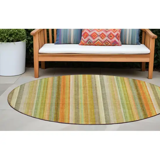 8' Round Tan Orange and Green Round Striped Washable Non Skid Indoor Outdoor Area Rug Photo 1