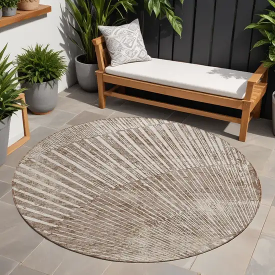 Taupe and Ivory Round Abstract Washable Non Skid Indoor Outdoor Area Rug Photo 1