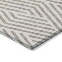 Photo of 8' Round Taupe and Ivory Round Geometric Washable Non Skid Indoor Outdoor Area Rug