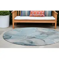 Photo of 8' Round Teal Round Abstract Washable Non Skid Indoor Outdoor Area Rug