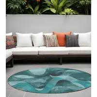 Photo of 8' Round Teal Round Abstract Washable Non Skid Indoor Outdoor Area Rug