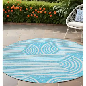 Photo of 8' Round Teal Round Abstract Washable Non Skid Indoor Outdoor Area Rug