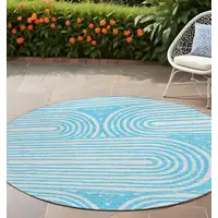 Photo of 8' Round Teal Round Abstract Washable Non Skid Indoor Outdoor Area Rug