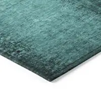 Photo of 8' Round Teal Round Abstract Washable Non Skid Indoor Outdoor Area Rug