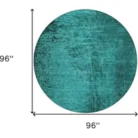 Photo of 8' Round Teal Round Abstract Washable Non Skid Indoor Outdoor Area Rug