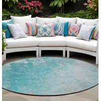 Photo of 8' Round Teal Round Abstract Washable Non Skid Indoor Outdoor Area Rug