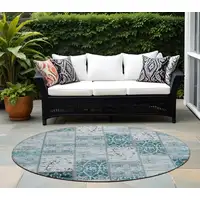 Photo of 8' Round Teal Round Patchwork Washable Non Skid Indoor Outdoor Area Rug